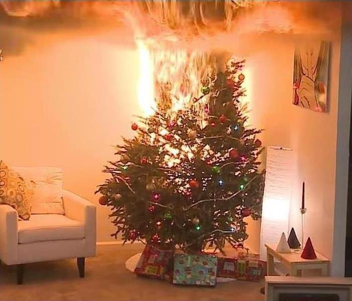 A decorated Christmas tree in fire