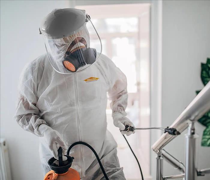 a SERVPRO tech spraying SERVPROOxide