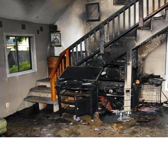 Fire damaged staircase and living room in a Ventura, CA home